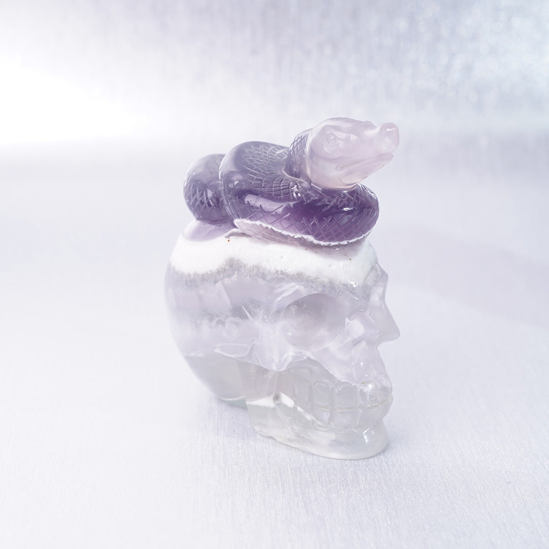 Fluorite Crystal Carving Purple Snake lying on Skull
