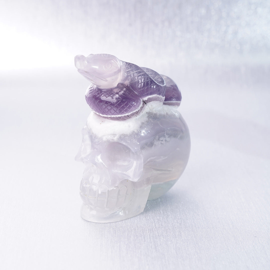 Fluorite Crystal Carving Purple Snake lying on Skull