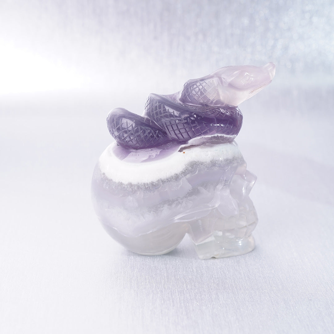 Fluorite Crystal Carving Purple Snake lying on Skull