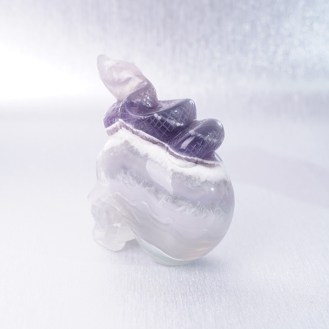 Fluorite Crystal Carving Purple Snake lying on Skull