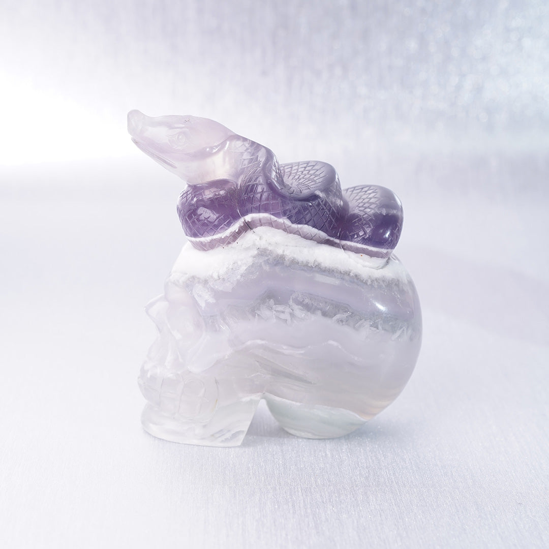 Fluorite Crystal Carving Purple Snake lying on Skull